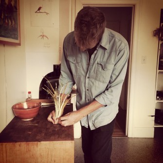 Cal, figuring out what to do with the Swiss chard stems.