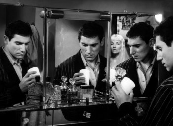 Robert Hossein and Marina Vlady in Toi le venin (Blonde in a White Car) .]