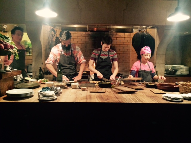 Camino's open kitchen, with Russ Moore (far left), cooking the Prune menu. Photo by Cari Borja