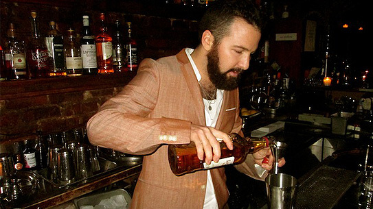 Sam Ross preparing The Penicillin.