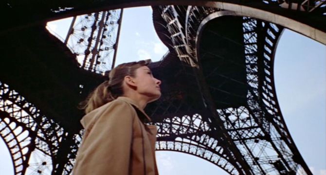 Jo (Audrey Hepburn) looking up at the Eiffel Tower in Funny Face .