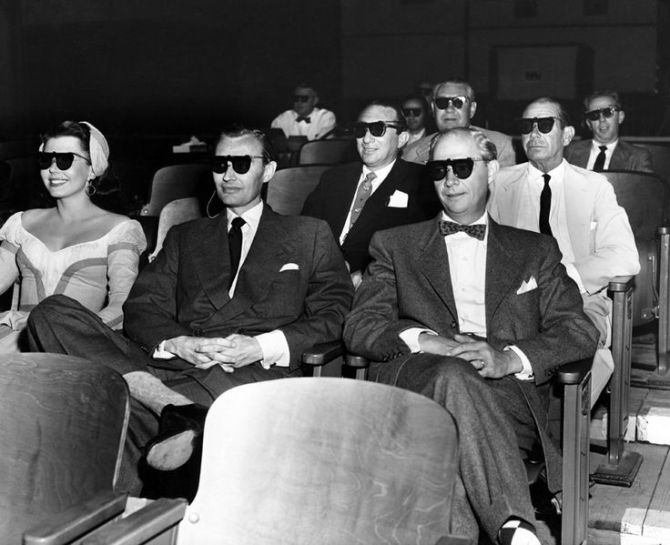 In 1953, MGM offered its first (and only) film in the then-popular 3D format, "Kiss Me Kate." The original stage show's composer, Cole Porter, tries out his 3D glasses here (second row, far right) along with (front row, from left) the movie's star Ann Miller, stage producer Lemuel Ayers, and singer George Byron, along with (second row) producer Jack Cummings.