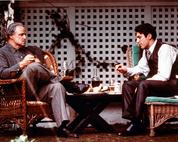 Marlon Brando as Don Vito Corleone and Al Pacino as Michael Corleone in a publicity still for The Godfather. Credit: Silver Screen Collection/Getty Images.