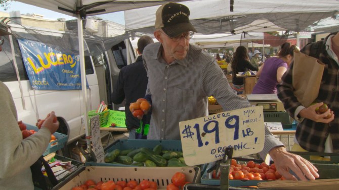 Michael Pollan at a farmers market. From In Defense of Food.