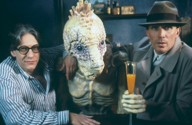 Director David Cronenberg and actor Peter Weller pose with a mugwump. Naked Lunch, 1991 – CREDIT: Photographer Atilla Dory© Recorded Picture Company (Productions) Limited and Naked Lunch Productions Limited, 1991