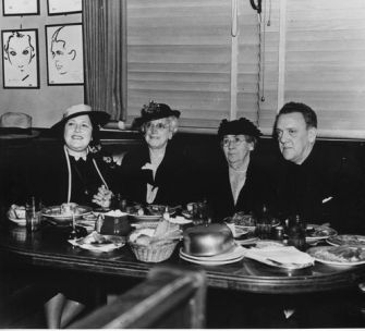 Louella Parsons (left) dining at the Brown Derby.