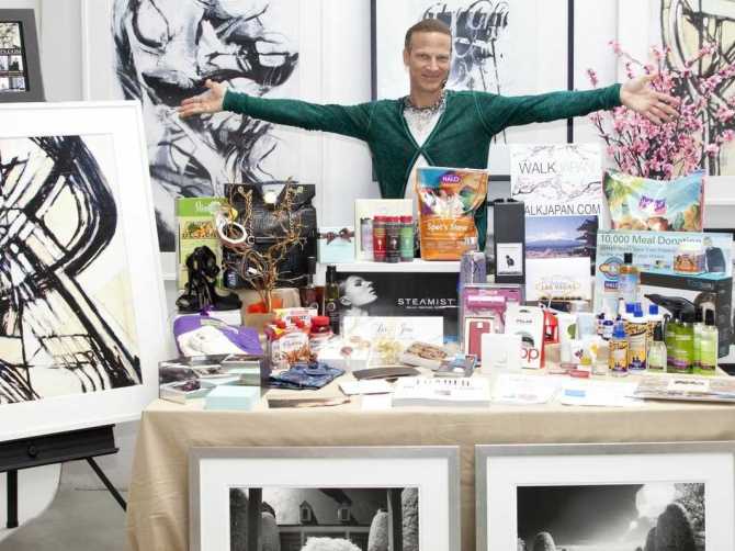 Lash Fary with some of the 2014 Unofficial Oscar Goodie Bag goodies his team assembled. –Photo courtesy of Business Week