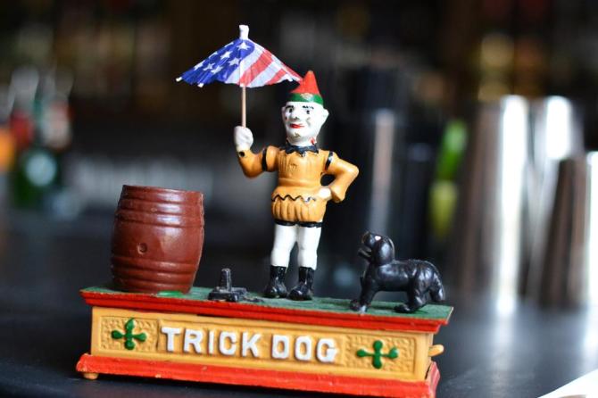 Trick-Dog-founder-Josh-Harris-named-the-bar-after-one-of-these-vintage-cast-iron-piggy-banks-the-clown-usually-holds-a-hoop-for-the-mechanical-jumping-dog._.jpg